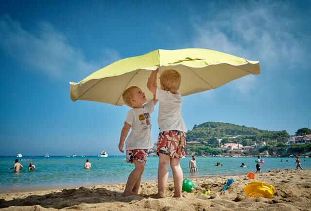 Kids playing with each other on the beach