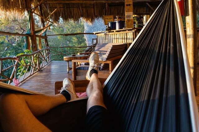 A person relaxing in the hammock