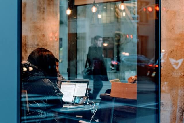 a woman working in a coffee shop