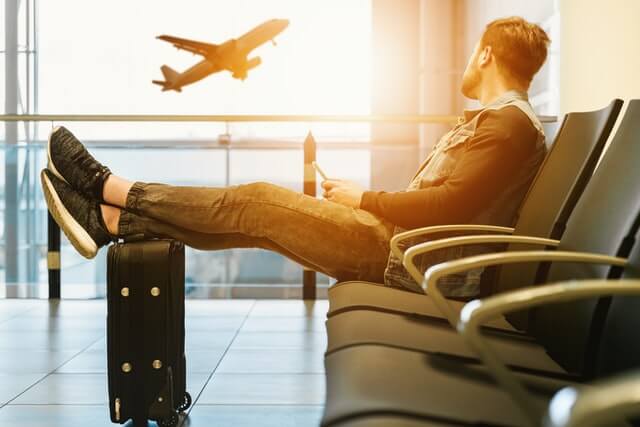 a man waiting for this airplane on the airport