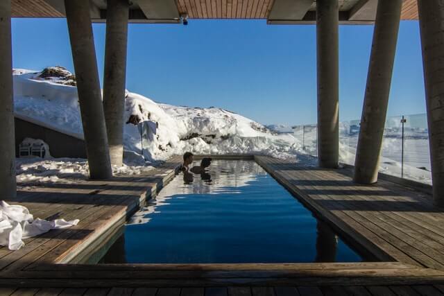 People relaxing in a warm pool in Iceland